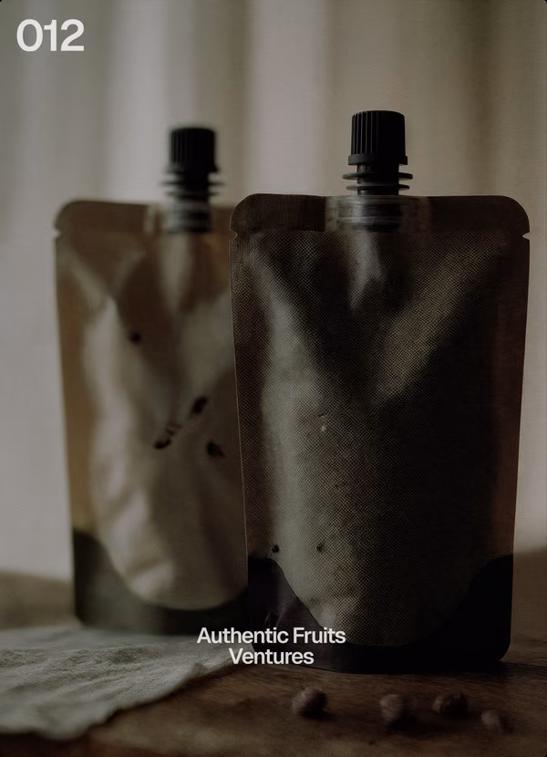 !F card 012: Authentic Fruits, ventures. Two pouches on a table.